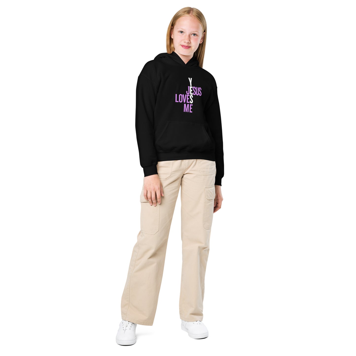 Person wearing a black hoodie with yes, 'Jesus Loves Me' text, beige pants, and white shoes on a white background